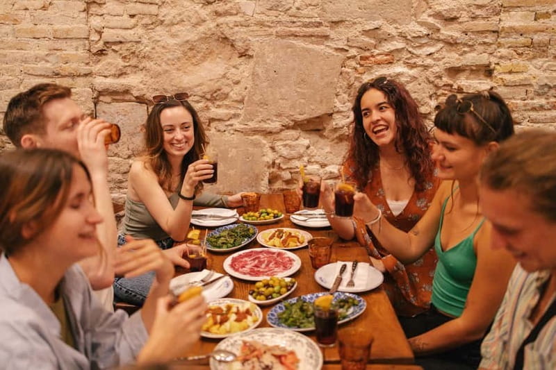 Barcelona: Food Walking Tour with Tapas and Wine - Nine tapas, from bravas to paella