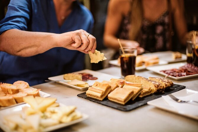 Barcelona Gothic Quarter Tapas & Taverns Food & Wine Tour - Stop one: charcuterie, cheese, and a Spanish classic