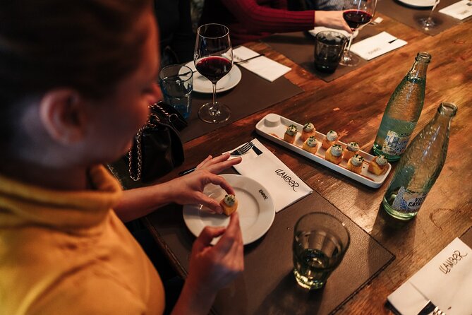 Barcelona: Guided Food Walking Tour with Tapas and Wine - Roman walls and the walk into El Born