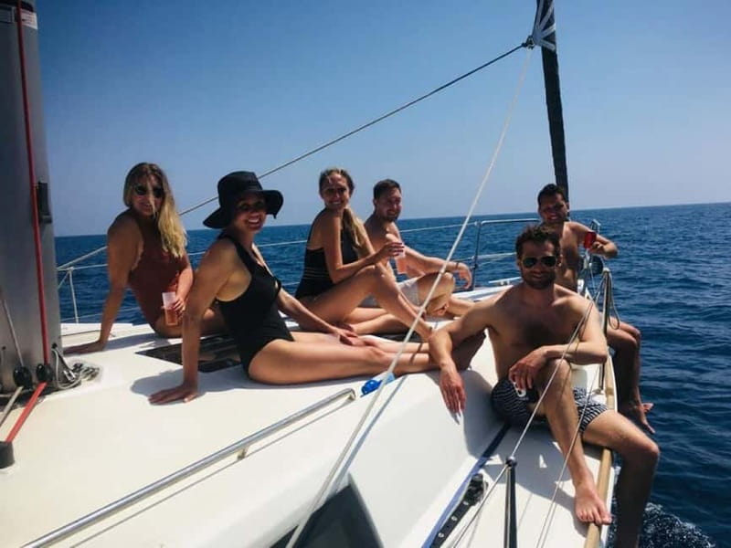 Barcelona: Sailing Tour + Food, Drinks, Swim & Sunset Option - Leaving Port Vela beside Barceloneta Beach