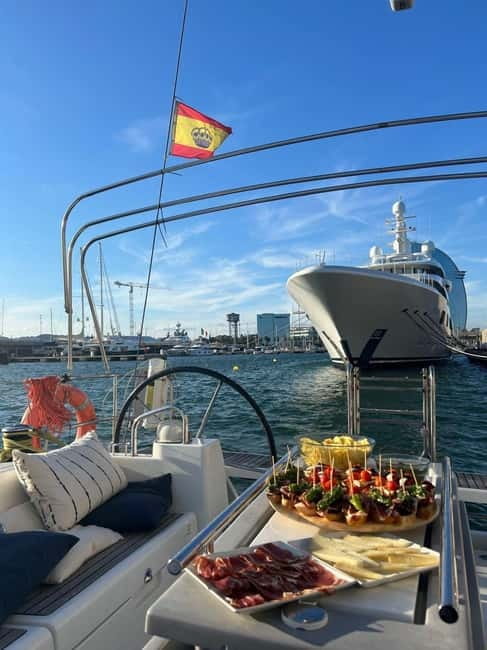 Barcelona: Sailing Tour + Food, Drinks, Swim & Sunset Option - Sailing past the harbor and Barcelona’s beaches