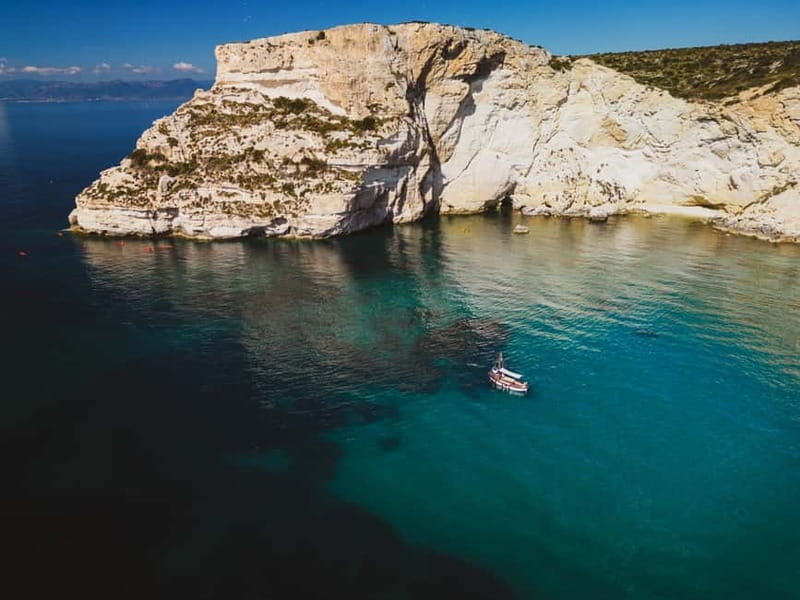 Cagliari: Gozzo Tour with 3 Swim Stops, Snorkel & Local Food - Cala Bernat begins with a quiet coastal view
