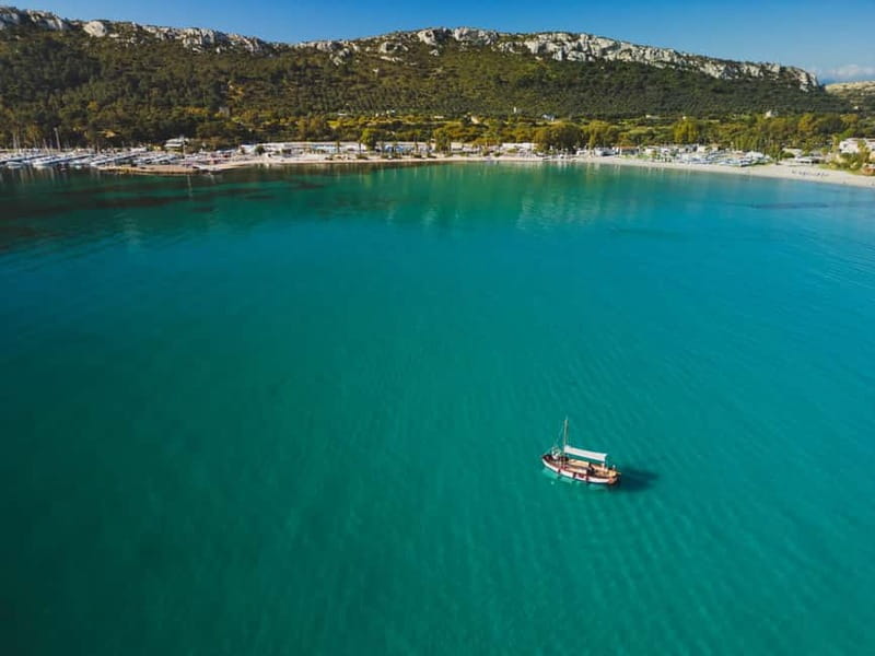 Cagliari: Gozzo Tour with 3 Swim Stops, Snorkel & Local Food - Leaving Molo Dogana with a practical warning