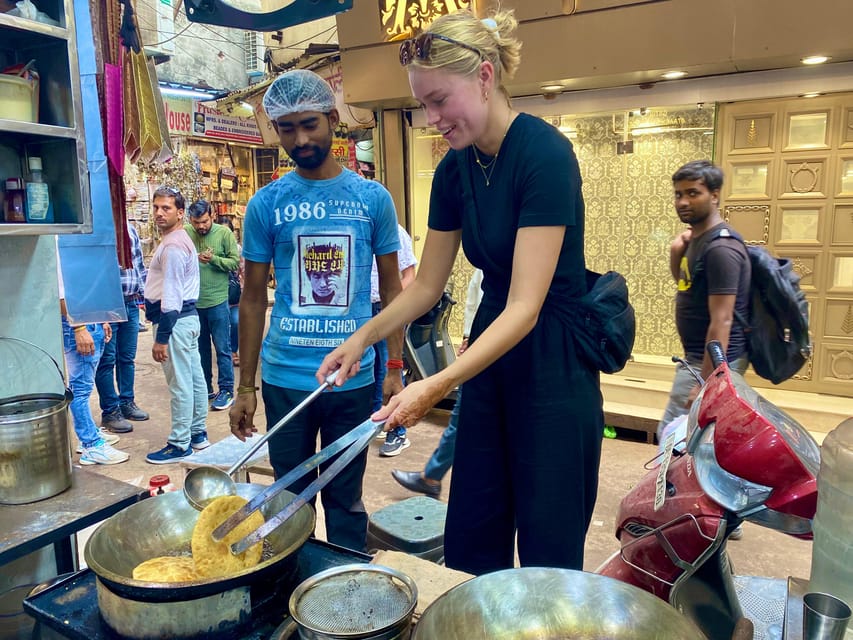 Delhi: Old Delhi's Street Food, Temples & Spice Market Tour - Red Fort and mosque views along the way