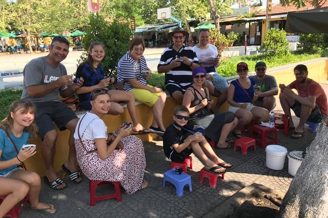 Evening Walking Food Tour, folk game and lantern boat - Banh mi, cao lau, and a full local dinner