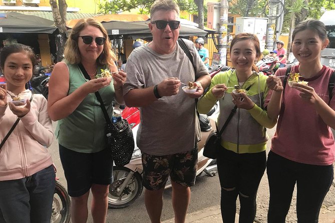 Evening Walking Food Tour, folk game and lantern boat - Vietnamese bingo or dap nieu pot breaking