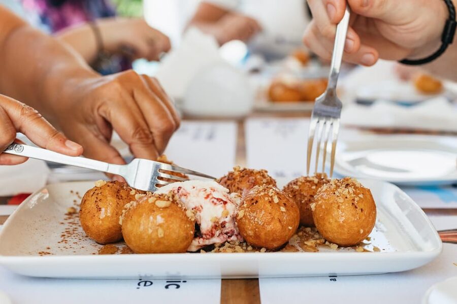 Fira: Guided Foodie Walking Tour with Tastings - Walking beside the caldera toward Fira