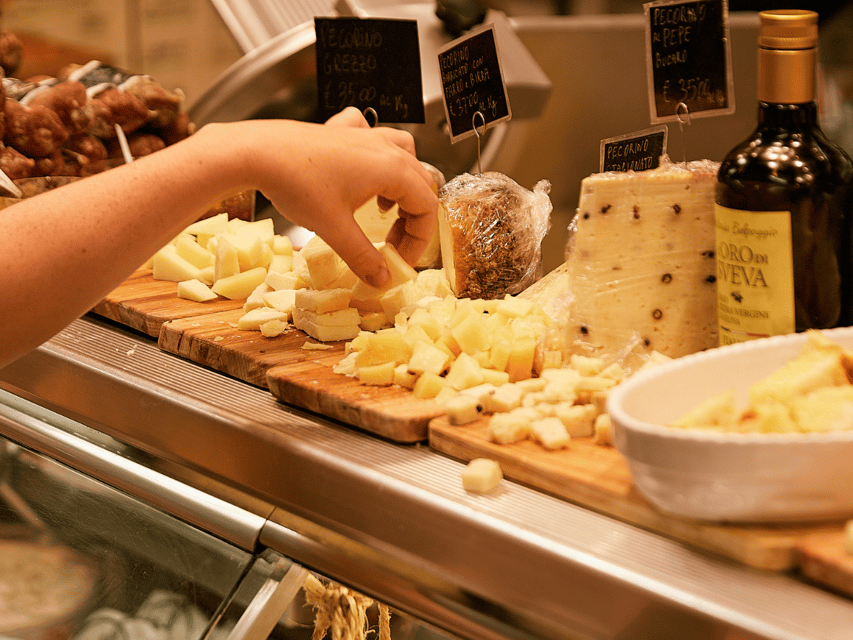 Florence: Cooking Class with Local Food Market Tour - Sitting down to a meal with Chianti