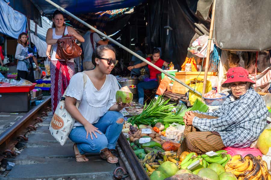 From Bangkok: Maeklong Railway and Floating Market Food Tour - The train that cuts through Mae Klong Market