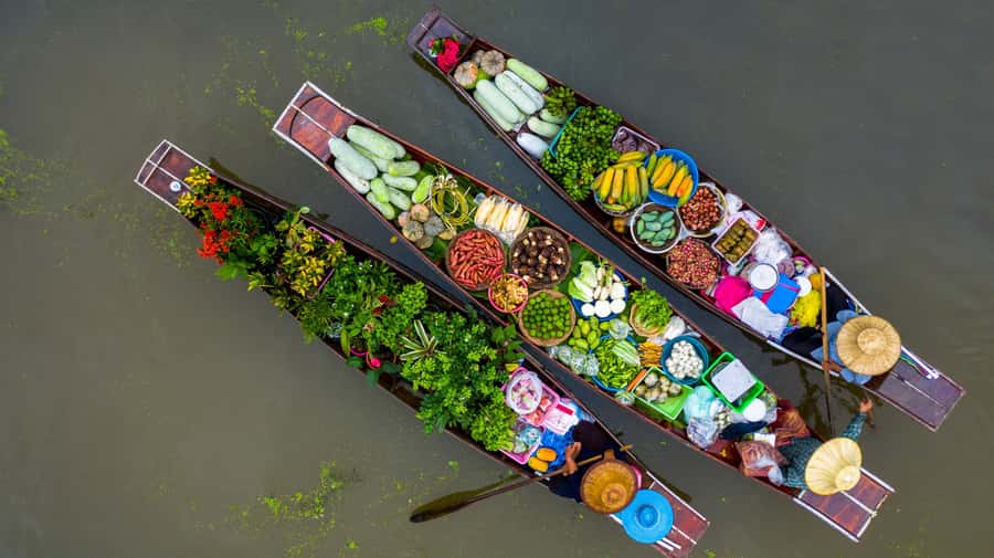 From Bangkok: Maeklong Railway and Floating Market Food Tour - Reaching Damnoen Saduak by longtail boat