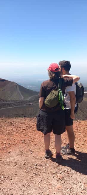 From Siracusa: Etna Tour - Trek, Wine and Food - Entering a lava cave with helmet and poles