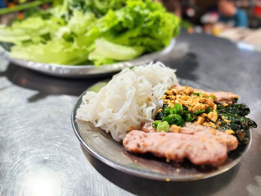Ho Chi Minh City: Food Tour by Scooter with Eleven Tastings - An old apartment area, sugarcane juice, and bún bò Huế