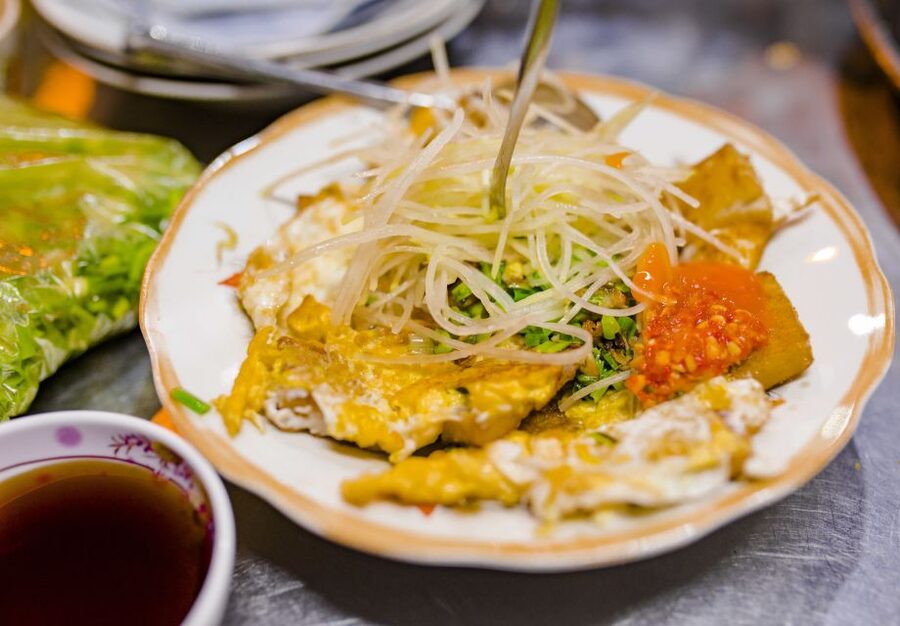 Ho Chi Minh City: Private Street Food Evening Walking Tour - Beef in wild betel leaves or thick noodle soup