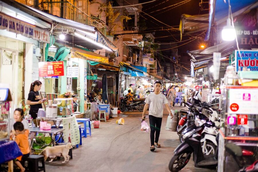 Ho Chi Minh City: Private Street Food Evening Walking Tour - The first taxi ride leaves the tourist center behind