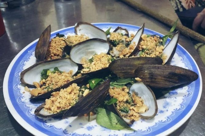 Ho Chi Minh City: Street Food Walking Tour with 12 Tastings - Ending with steamed oysters