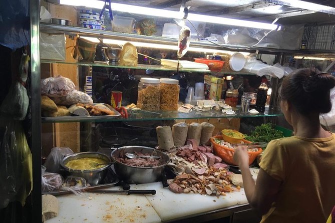 Ho Chi Minh City: Street Food Walking Tour with 12 Tastings - Starting with Bún Bò Huế and jasmine iced tea