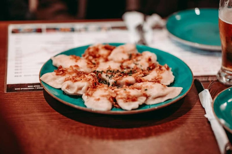 Krakow: Tipsy Polish Food Tour With History, Pierogi & Shots - Krakow stories between the food stops