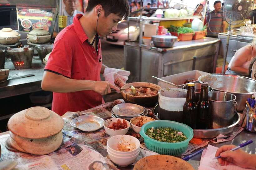Kuala Lumpur: Nightlife Street Food Tour with 6 Tastings - Beef meatball soup and charcoal-fired claypot chicken rice