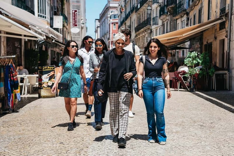 Lisbon: Baixa District Food Tour with Dinner and Drinks - Starting under the Portuguese flag at Praça do Comércio
