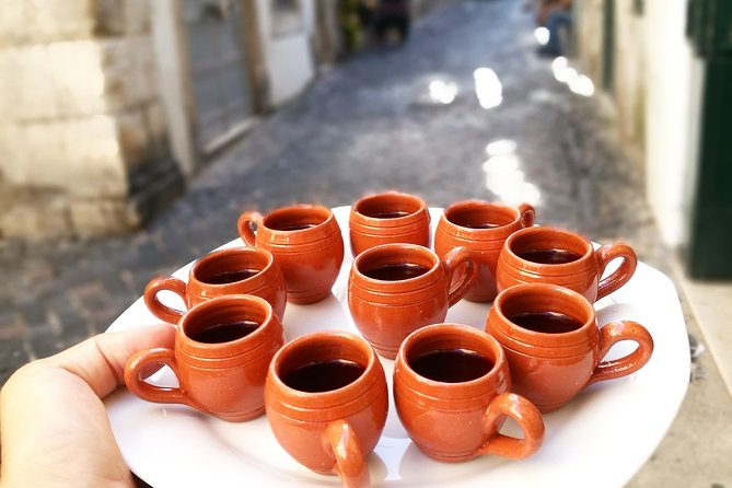 Lisbon Small-Group Food Tour with 18 Tastings in Alfama District - Chafariz d’El Rei and the stories between bites