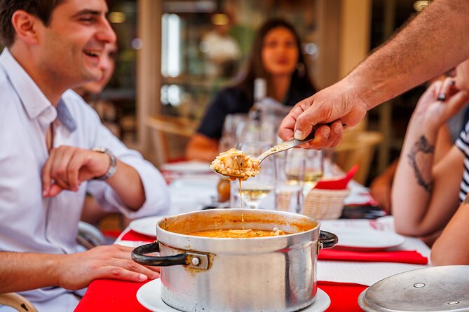 Lisbon Small-Group Portuguese Food and Wine Tour - Rossio Square starts the meal with cod and vinho verde