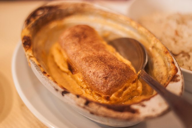 Lyon Old Town Food Tour with 6 French Delicacies & Fine Wine - A hot dish at family-run Chez M’man