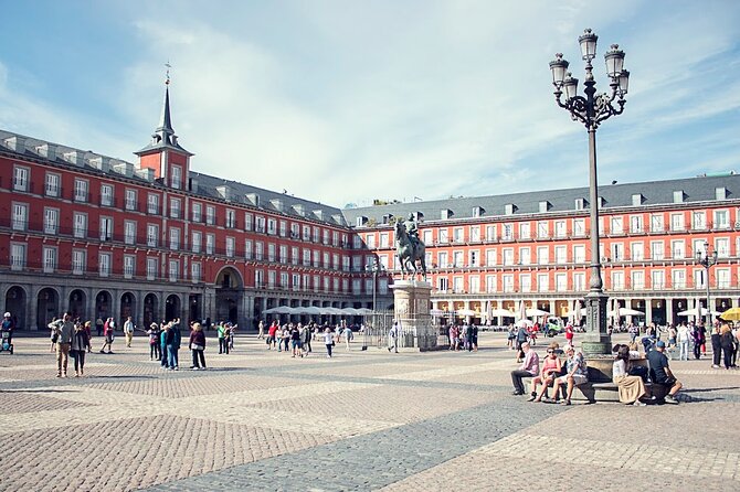 Madrid Historic Centre Food Tour with Authentic Tapas & Wines - Walking through Plaza Mayor and Madrid’s central squares