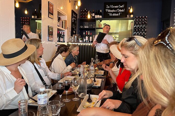Montmartre Hill French Gourmet Food and Wine Tasting Walking Tour - Place du Tertre and the village atmosphere