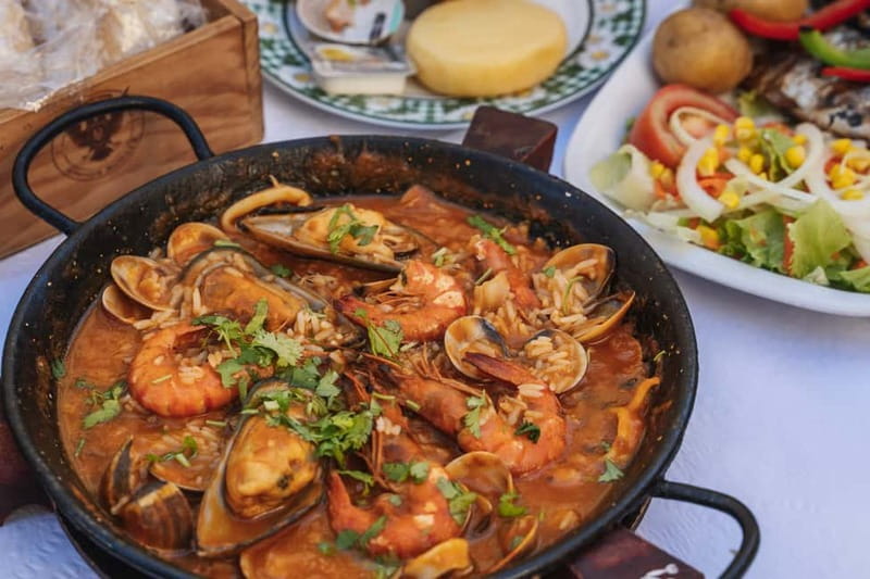 Private Lisbon Food Tour in Baixa with Wine & Local Delights - Meeting beneath the Portuguese flag