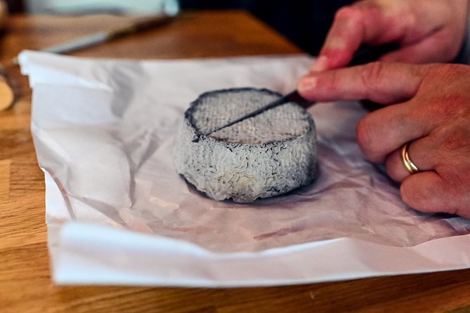 Private Montmartre Food Tour with Wine, Cheese & Pastries - The fabric district and Montmartre’s working side
