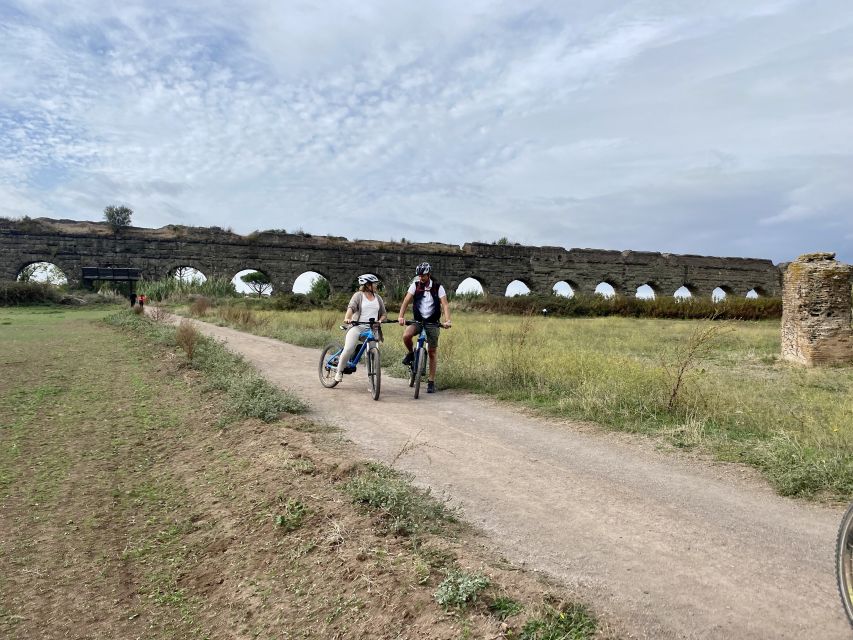 Rome: Appian Way & Aqueducts E-Bike Tour (Catacombs & Food) - The Aqueducts Park and its giant stone arches