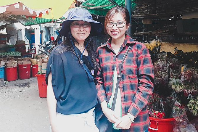 Saigon Night Sights & Local Food by Motorbike| Opt: Ao Dai Riders - An 1986 building and the city’s layered past