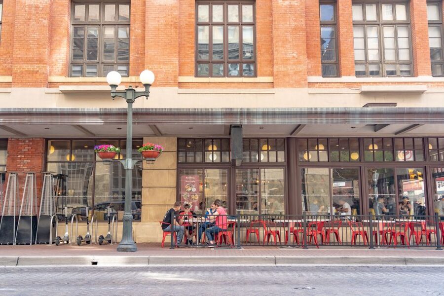 San Antonio: Historic Downtown Food and Culture Walking Tour - Brisket fries, grilled cheese, and the long wooden bar