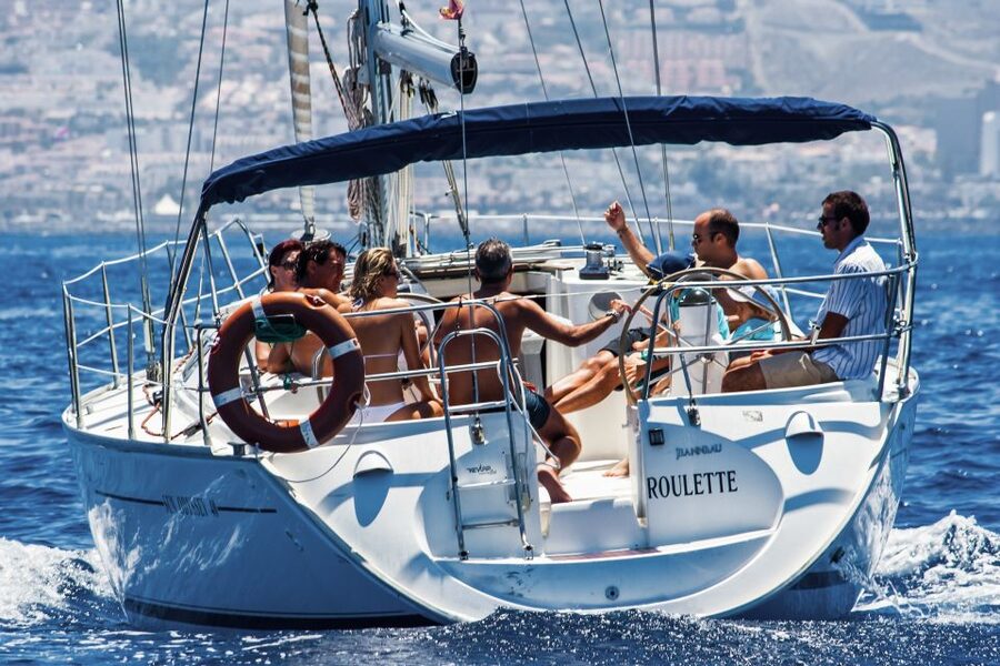 Tenerife: Sailboat Tour Whale Watching Food and Snorkeling - A swim and snorkel stop in a sheltered bay