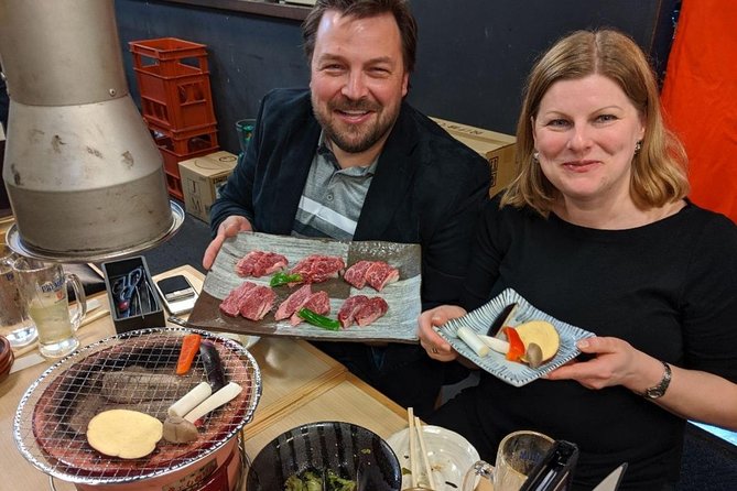 Tokyo Night Foodie Tour in Shinjuku - Seasonal Sushi, Wagyu Beef - Kabukicho after sunset